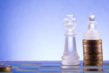 Chess on a golden coins. Investment strategy. Finance concept.