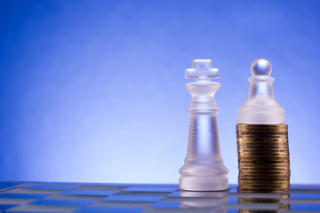 Chess on a golden coins. Investment strategy. Finance concept.