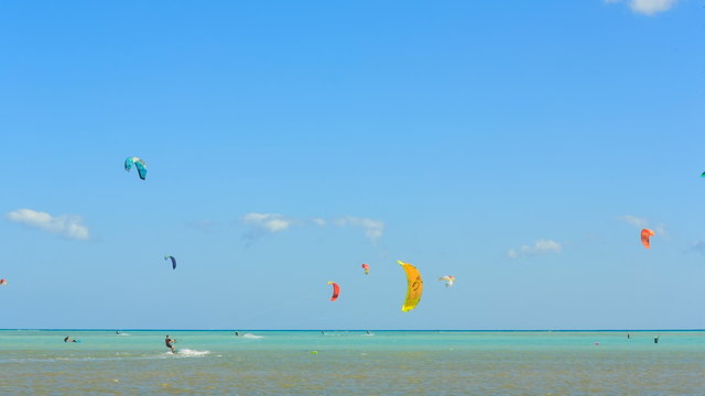 People engaged in kite surfing in the Kite Village at the Red Sea near Hamata Marine.