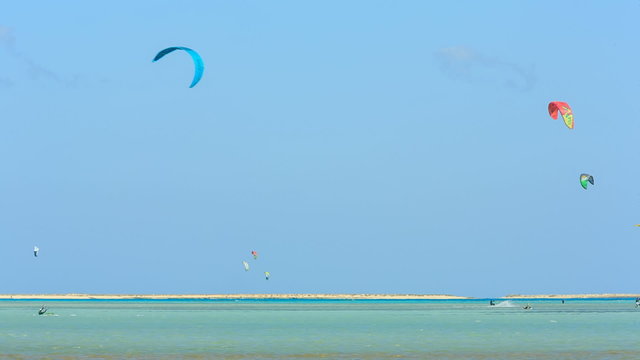 People engaged in kite surfing in the Kite Village at the Red Sea near Hamata Marine.