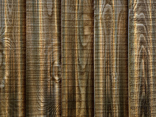 Brown wooden fence panels with knots in closeup