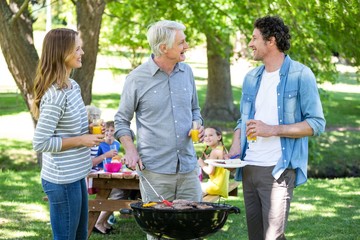 Family having a picnic with barbecue