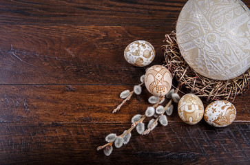  Easter eggs in a nest on a wooden background. Easter Theme. Happy Easter