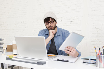 young hispanic attractive hipster businessman working at modern home office