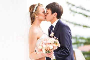 Wedding, Beautiful Romantic Bride and Groom Kissing 