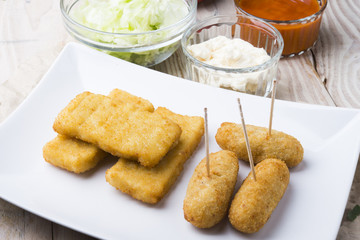 croquettes balls and different kind of sauces on a plate on a cl