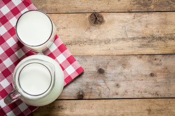 Fresh Milk on Glasses Bottle, Dairy Produce Concept of Breakfast on Wood Table Background, Country Rustic Still Life Style, Vintage Tone, Top view. Space for text.