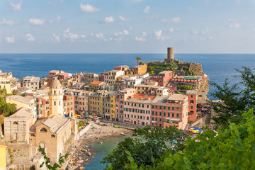 Scenic view of ocean and harbor in colorful village Vernazza, Ci