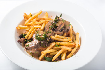 Roast pork on toast with mushrooms, sauce and french fries