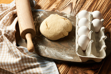 Dough and ingredients on table