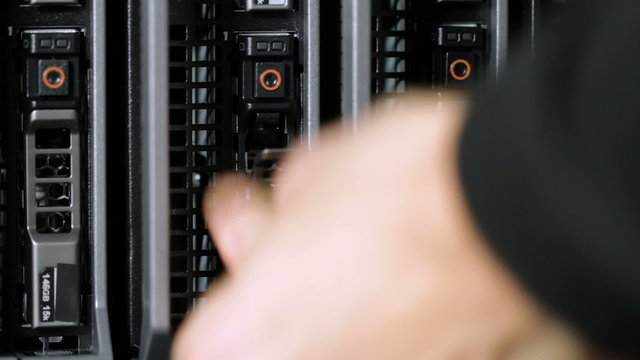 IT consultant install hard drive in server