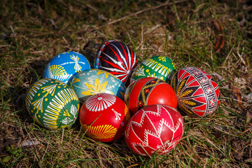 painted Easter eggs on a green greas background.