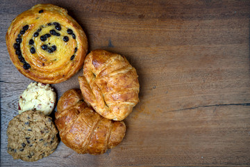 croissant danish and cookie bakery on teak wood table