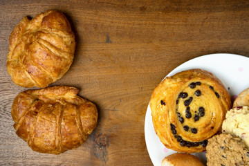 croissant danish and cookie bakery on teak wood table