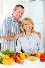 Cheerful mature man and woman smiling together
