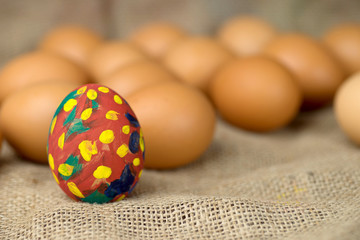 painted egg on burlap
