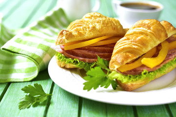 Croissant sandwich with salami and bell pepper.