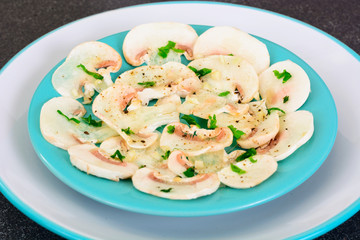 Vegetarian food: mushroom carpaccio with parmesan.