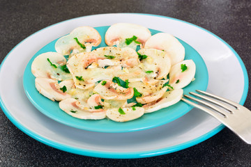 Vegetarian food: mushroom carpaccio with parmesan.