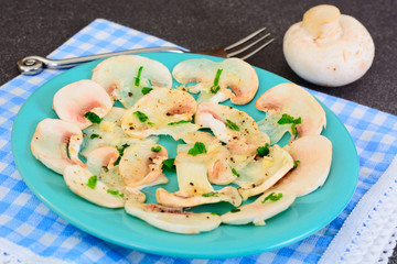 Vegetarian food: mushroom carpaccio with parmesan.