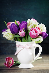 Naklejka na ściany i meble Beautiful tulips bouquet on wooden table