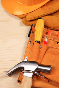 Set of working tools on wooden background