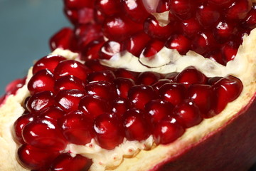  Ripe and juicy pomegranate broken into pieces, closeup
