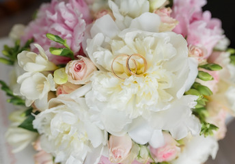 Beautiful wedding bouquet in hands of the bride
