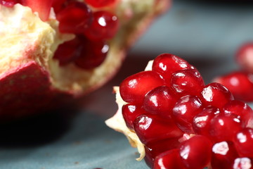  Ripe and juicy pomegranate broken into pieces, closeup