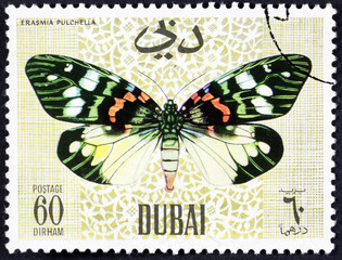 Fototapeta na wymiar DUBAI - CIRCA 1968: A stamp printed by Dubai, shows Butterflyv, Circa 1968