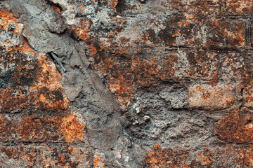 Old brick wall with concrete seam