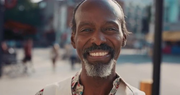 Slow Motion Portrait of happy mature african american man smiling