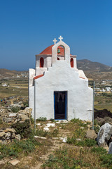 Fototapeta premium Frontal view of White church with red roof on Mykonos island, Cyclades, Greece