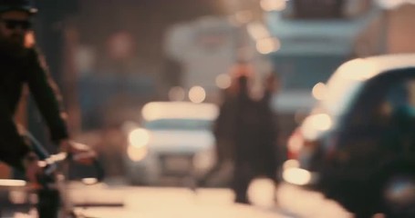 Anonymous crowd of people walking cycling bicycles commuters London City street slow motion