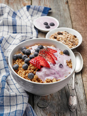 bowl of muesli with yogurt and berries