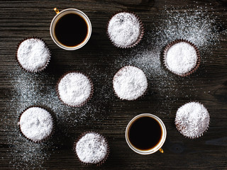 Chocolate cupcake with two cups