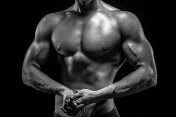 Fototapeta na wymiar Close-up of man model torso posing showing perfect body
