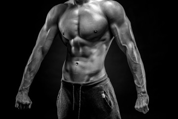 Fototapeta na wymiar Close-up of man model torso posing showing perfect body
