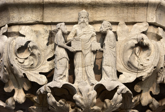 Aristotle and disciples on Doge's Palace beautiful capital, in Saint Mark Square, Venice