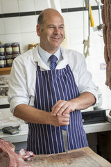 Laughing butcher with a large knife