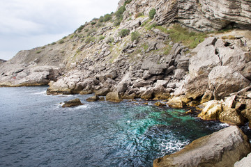Fototapeta na wymiar Sea and old rocks