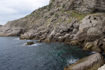 Fototapeta na wymiar Sea and old rocks