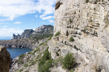 Sea and rocks under sky