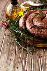 raw beef sausages on a cast-iron pan,  selective focus