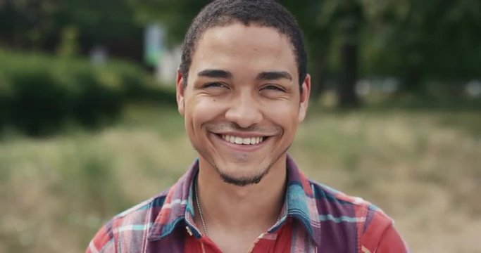 Slow Motion Portrait of happy mixed race man laughing