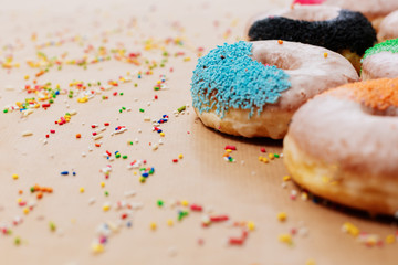 Colorful donuts on paper  background