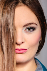 Portrait young woman face cover with hair.