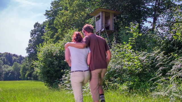 Couple walking near the hunting observatory 