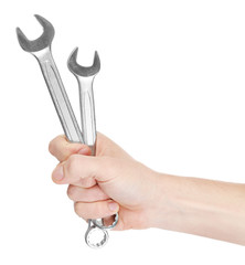 A hand of repairman holding wrenches, on white background, close-up