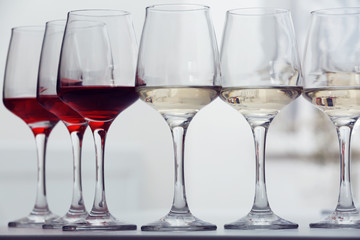 Wine glasses with red and white wine, closeup